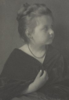 Portrait of a girl with a necklace clasping a shawl, c1900. Creator: Alice Austin.