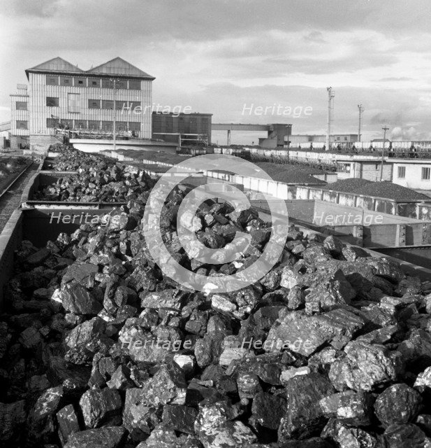 Rail trucks loaded with coal leaving Lynemouth Colliery, Northumberland, 1963.  Artist: Michael Walters