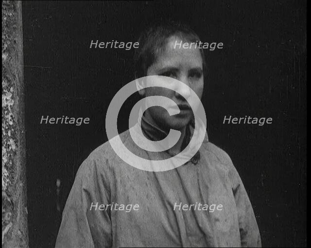 An Irish Woman Sporting a Shaved Head as Punishment for Consorting With British Soldiers, 1920. Creator: British Pathe Ltd.
