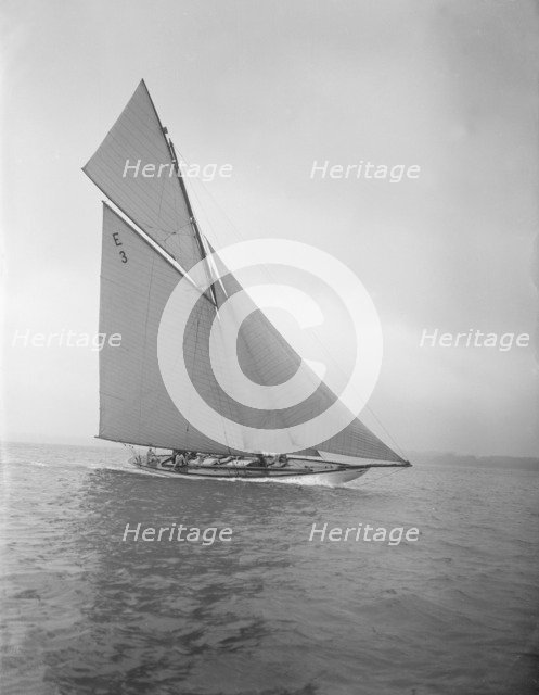 The 12-metre 'Ierne' sailing close-hauled, 1911. Creator: Kirk & Sons of Cowes.