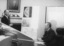 Dr William Pickering shows President Johnson photographs taken by Ranger VII, 1964. Artist: Unknown