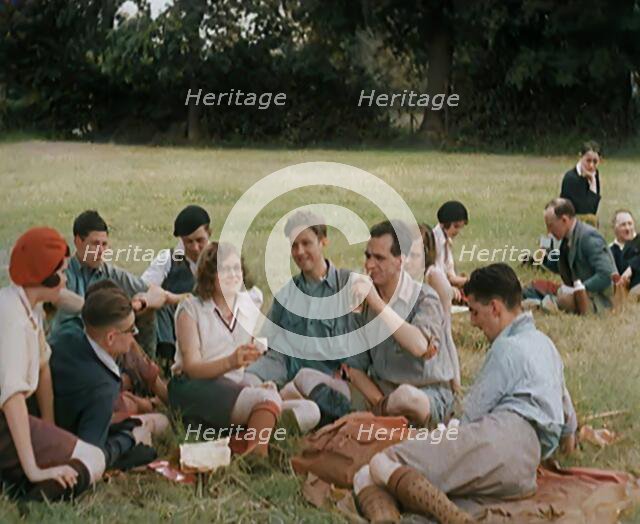 A Large Group of Hikers Having Drinks in a Field, 1931. Creator: British Pathe Ltd.