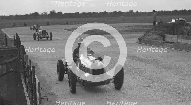 MG racing at Brooklands, Surrey, c1930s. Artist: Bill Brunell.