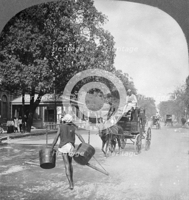 Watering the streets of Rangoon, Burma, 1908. Artist: Stereo Travel Co