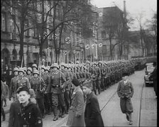 German Civilians Watching German Troops Moving Through the Rhineland, 1936. Creator: British Pathe Ltd.