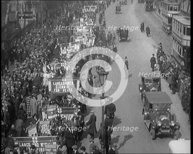 Civilians Demonstrating in London Against Continuous Strikes in the Rain. Signs Read..., 1926. Creator: British Pathe Ltd.