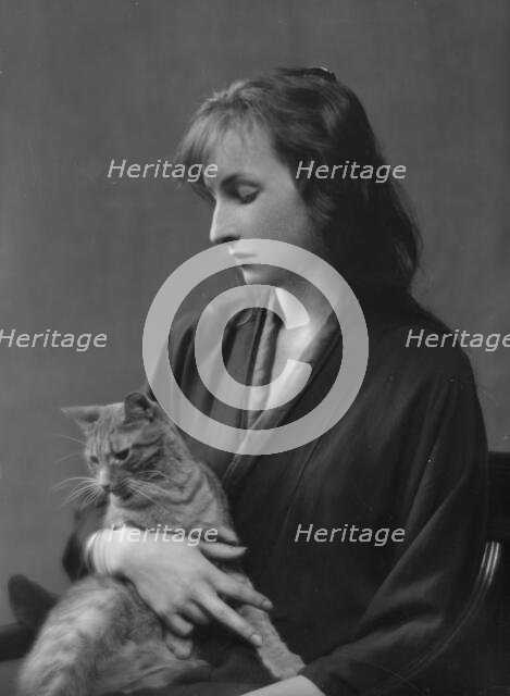 Whittaker, Miss, with Buzzer the cat, portrait photograph, 1916. Creator: Arnold Genthe.