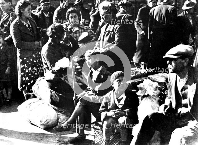 Belgian refugees with their bicycles and possessions outside the Gare du Nord, Paris, July 1940. Artist: Unknown