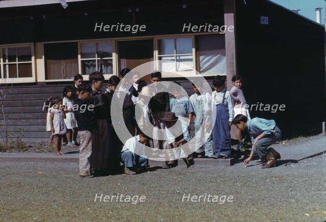 Boys playing marbles, FSA ... labor camp, Robstown, Texas, 1942. Creator: Arthur Rothstein.