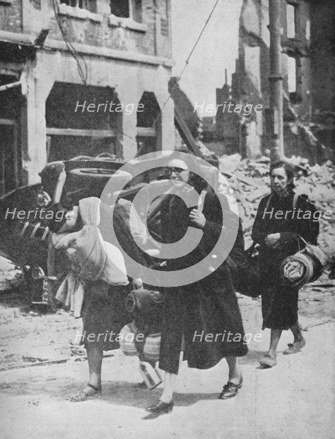 'British troops hold out in Louvain as refugees leave the city', 1940, (1940). Artist: Unknown.