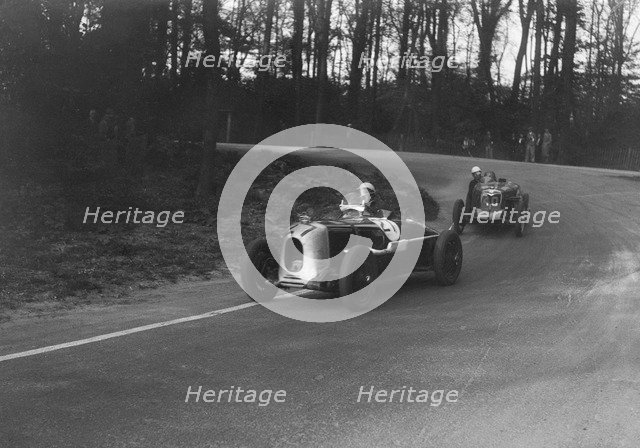 MG Magnette of AA Rigby leading JR Grice's Riley Brooklands at Donington Park, Leicestershire, 1935. Artist: Bill Brunell.