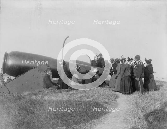Class from Hampton Institute, Hampton, Va., looking at cannon at Fort Monroe, 1899 or 1900. Creator: Frances Benjamin Johnston.