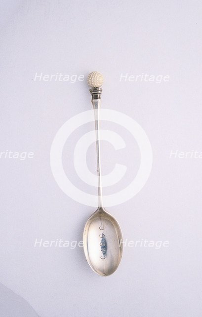 Silver spoon with golf ball motif, c1910. Artist: Unknown