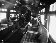 Buffet library car on a deluxe overland limited train, between 1910 and 1920. Creator: Unknown.