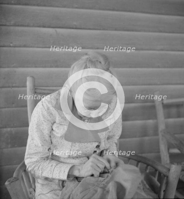 Southern lady of the old school on veranda...at the Wray Plantation, Georgia, 1937. Creator: Dorothea Lange.
