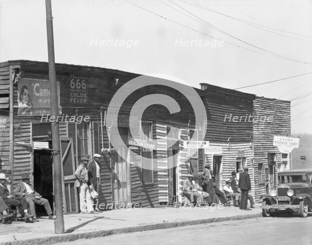 Vicksburg Negroes and shop front, Mississippi, 1936. Creator: Walker Evans.