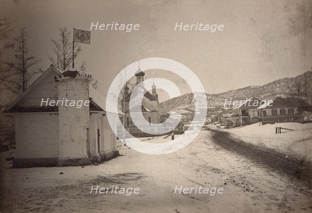 View of a settlement or village with a government(?) building and a church..., between 1885 and 86. Creator: Unknown.
