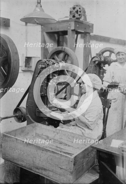 Crimping ignition tubes, between c1915 and c1920. Creator: Bain News Service.