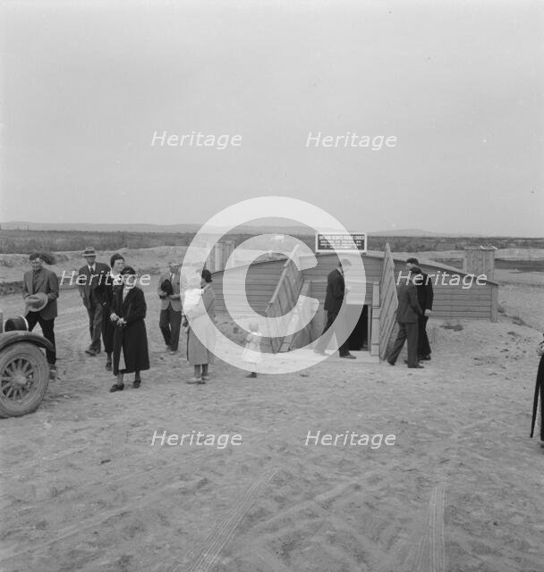 Congregation leaving after services, Dead Ox Flat, Malheur County, Oregon, 1939. Creator: Dorothea Lange.