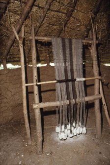 Loom with chalk loom weights, Butser Iron Age Farm, c20th century. Artist: CM Dixon.