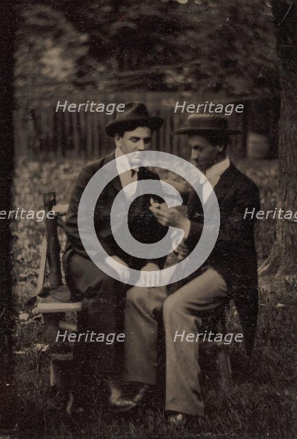 Two Men Seated on a Bench, One with His Hand on the Leg of the Other, 1870s-80s. Creator: Unknown.