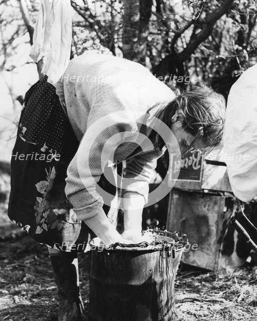 Woman doing the washing, Charlwood, Surrey, 1960s(?).