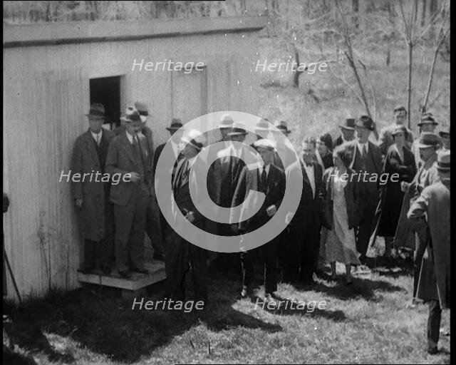 American Police Officers and Civilians in a Cemetery During a Kidnapping Investigation, 1930s. Creator: British Pathe Ltd.