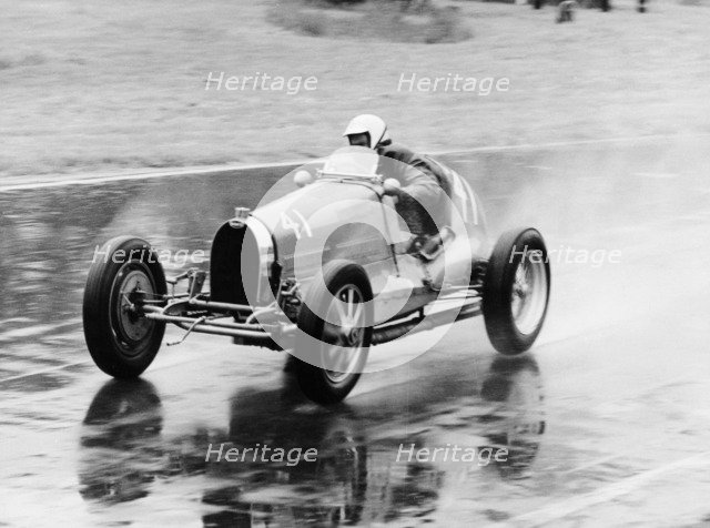 Frank Wall driving a Bugatti Type 35B, 1926. Artist: Unknown