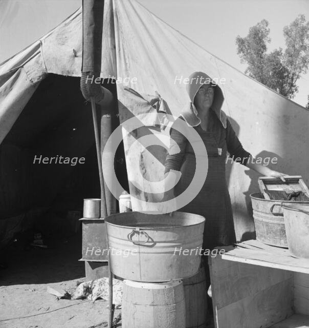 Texas woman in carrot pullers' camp, Imperial Valley, California, 1939. Creator: Dorothea Lange.