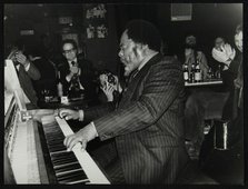 Roland Hanna playing the piano before an appreciative audience, 1980. Artist: Denis Williams