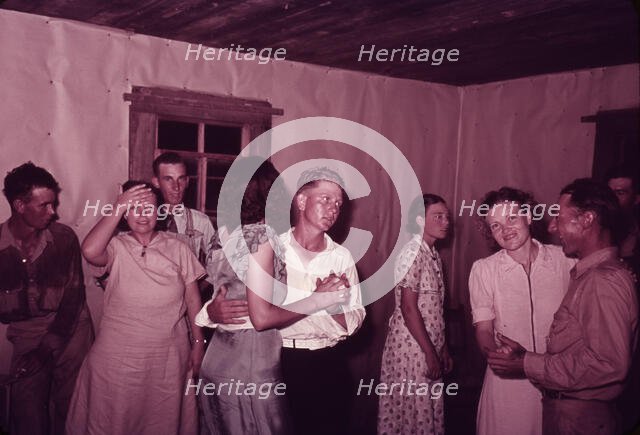 Scene at square dance in rural home in McIntosh County, Oklahoma, 1939 or 1940. Creator: Russell Lee.