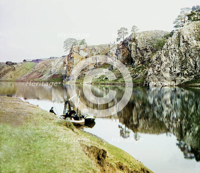 Upper Georgievskii Rock and a general view of the settlement of Utka, Chusovaya River, 1912. Creator: Sergey Mikhaylovich Prokudin-Gorsky.