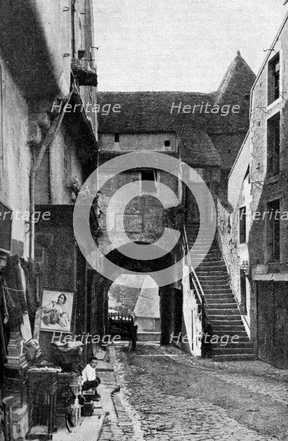 An old curiosity shop in Falaise, Normandy, France, c1930s. Artist: Humphrey Joel