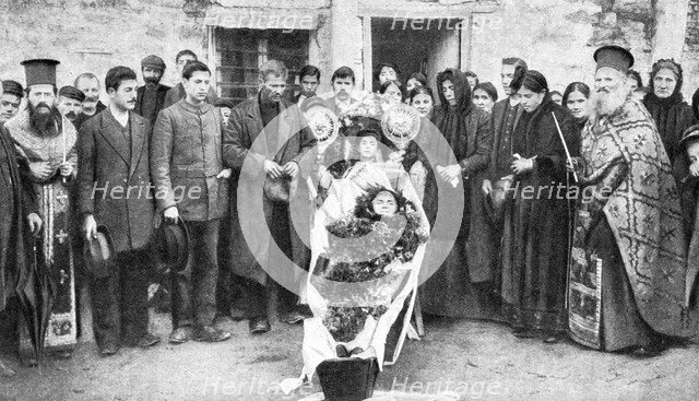 A dead Greek peasant lying in a coffin, 1922.Artist: HA Fawcett