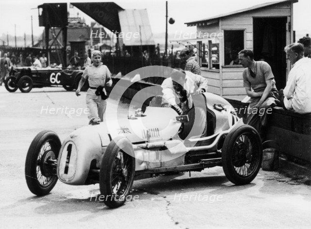 Kay Petre and Austin Seven, Brooklands, 1936. Artist: Unknown