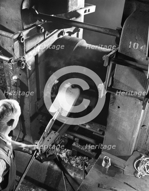 Rolling hot spades, garden tool manufacture, Sheffield, South Yorkshire, 1966. Artist: Michael Walters