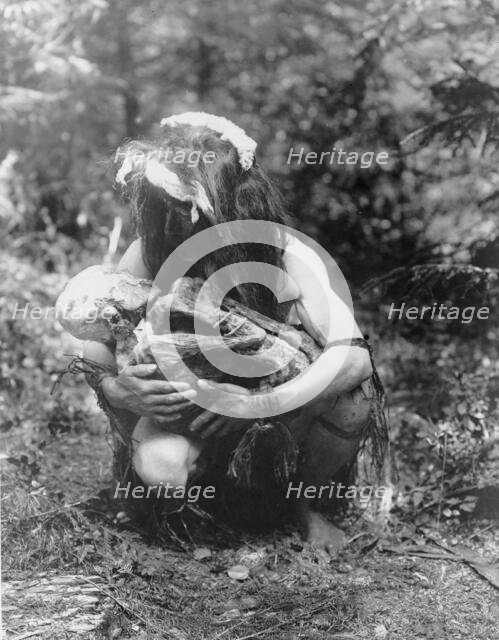 Preparing to eat the mummy, c1911. Creator: Edward Sheriff Curtis.