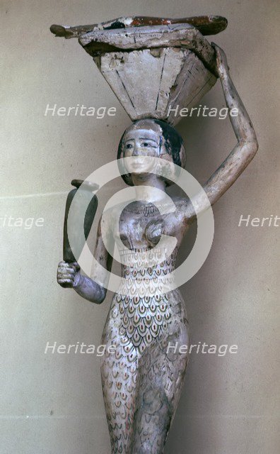 Egyptian statuette of a woman bearing offerings, 22nd century BC. Artist: Unknown