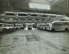 Ambulances in a garage, Western Ambulance Station, Fulham, 1939. Artist: Unknown.