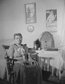 Elderly lady who lives on Lamont Street, N.W., Washington, D.C., 1942. Creator: Gordon Parks.
