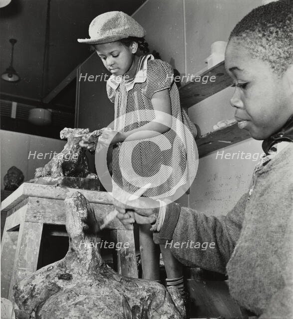 Girl and boy sculpting, Harlem Art Center, 1939. Creator: Berenice Abbott.