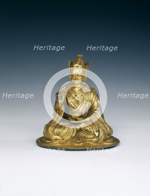 Gilt brass Padmasambhava holding attributes, Tibet, 16th-17th century. Artist: Unknown
