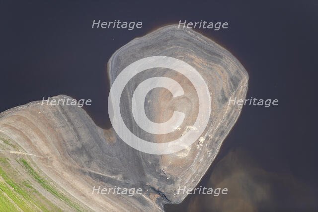 A ruined building revealed by low water levels at Howden Reservoir, Derbyshire, 2022. Creator: Emma Trevarthen.
