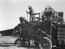 Bean thresher, mechanized agriculture between Turlock and Merced, California, 1936. Creator: Dorothea Lange.