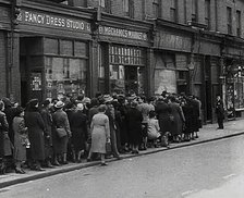 Civilians Queueing Outside a Food Shop, 1942. Creator: British Pathe Ltd.