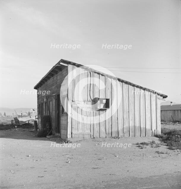 Cabin which rents for ten dollars a month in Arkansawyer's auto camp, Greenfield, CA, 1939. Creator: Dorothea Lange.