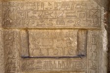 Hieroglyphic writing and deceased ofering food to the gods, Necropolis of Saqqara, Egypt, 2003. Creator: Unknown.