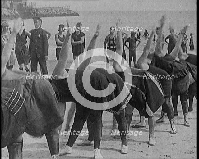 A Group of Plus Size Female Civilians Exercising on a Beach, 1920. Creator: British Pathe Ltd.