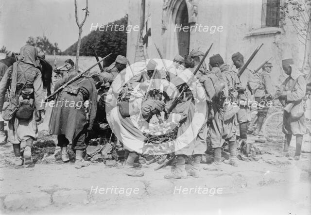 Turcos Examining War Booty at Neufmentiers, 1914. Creator: Bain News Service.