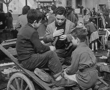 Italian Boys Talking With Other Civilians in the Background, 1944. Creator: British Pathe Ltd.